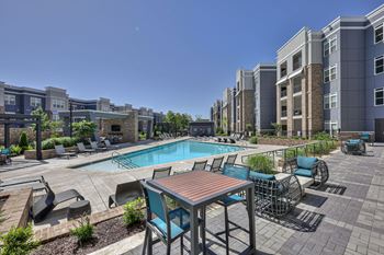 Resort-style swimming pool with sun ledge and private cabanas